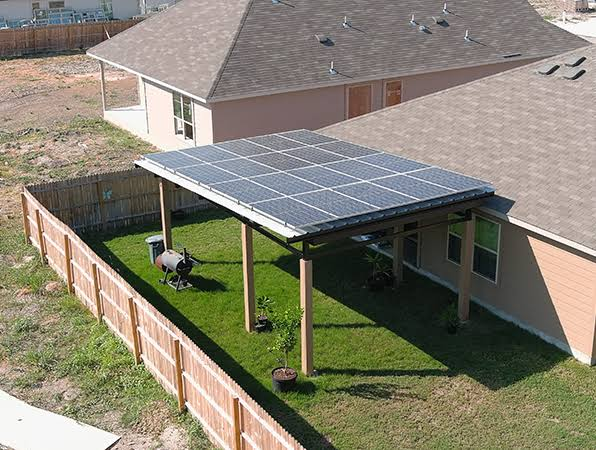 Residential roof structure covered with solar panels